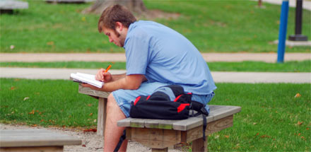 Student studying outside.
